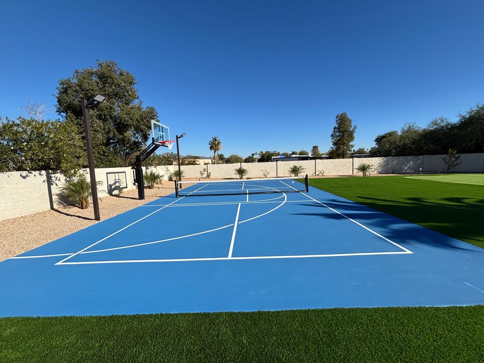 Blue backyard basketball and pickleball sport court in Phoenix, AZ
