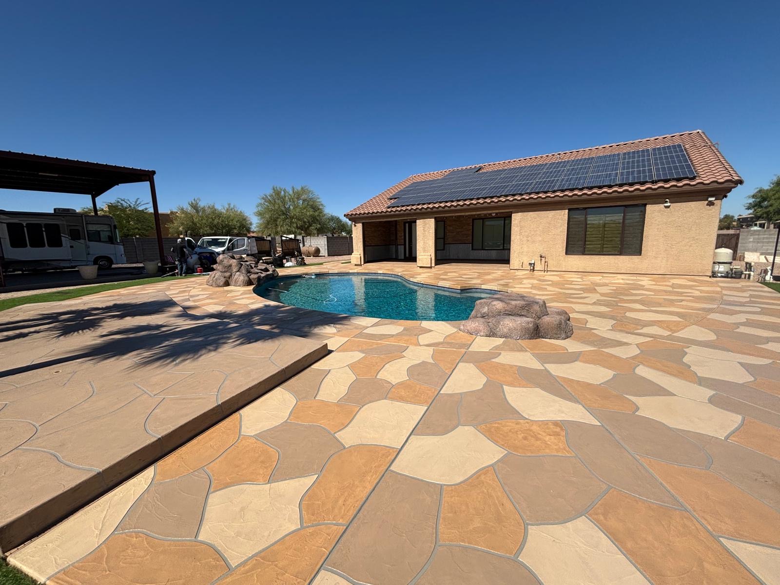 Stamped flagstone-style concrete pool deck resurfacing in Arizona